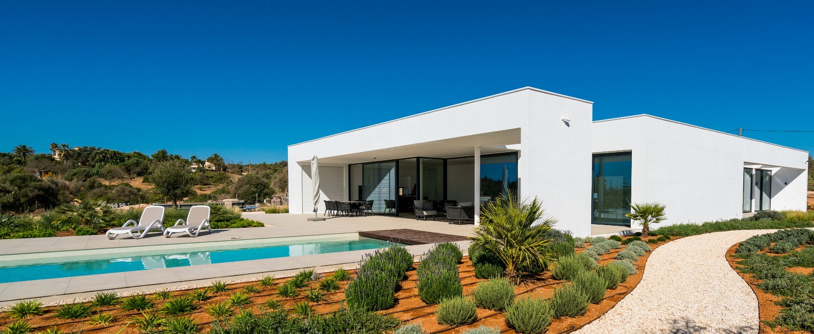 Bright Mediterranean home surrounded by greenery